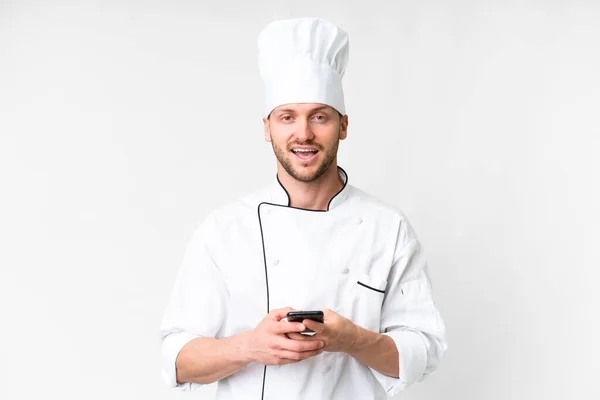 Young Caucasian Chef Isolated White Background Surprised Sending Message — Foto de Stock