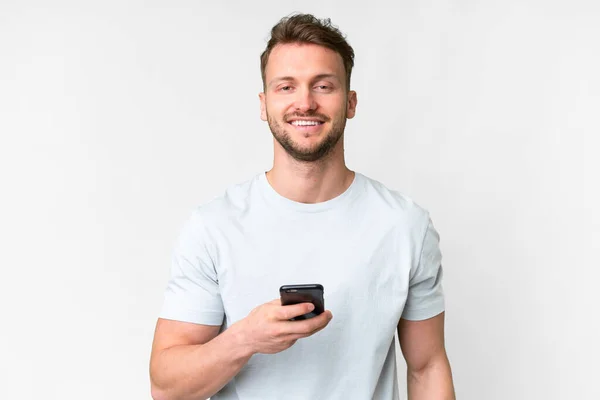 Mladý Pohledný Běloch Muž Přes Izolované Bílé Pozadí Pomocí Mobilního — Stock fotografie
