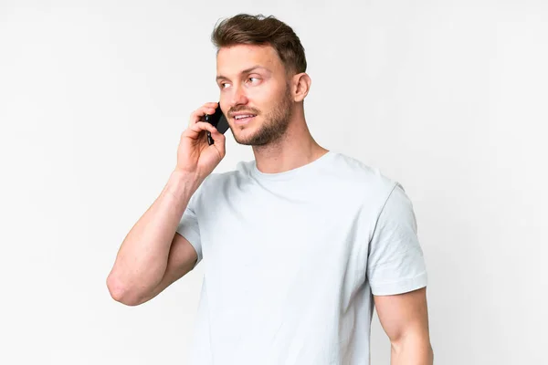Young Handsome Caucasian Man Isolated White Background Keeping Conversation Mobile — Stock Photo, Image