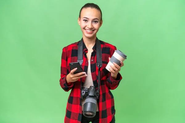 Young Photographer Arab Woman Isolated Background Holding Coffee Take Away —  Fotos de Stock