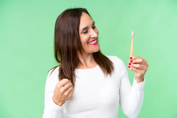 Middle Age Woman Brushing Teeth Isolated Chroma Key Background Celebrating — Stockfoto