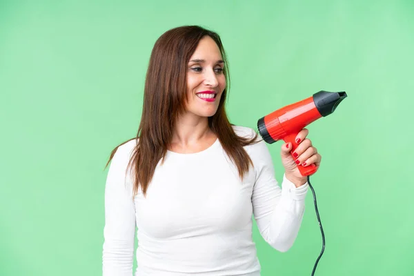 Middle Age Woman Holding Hairdryer Isolated Chroma Key Background Happy — Foto de Stock