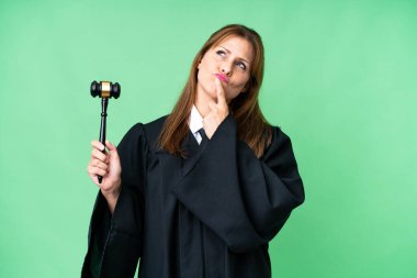 Judge caucasian woman over isolated background having doubts while looking up