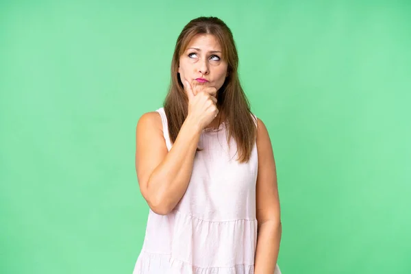 Middle Age Woman Isolated Background Having Doubts Confuse Face Expression — Fotografia de Stock