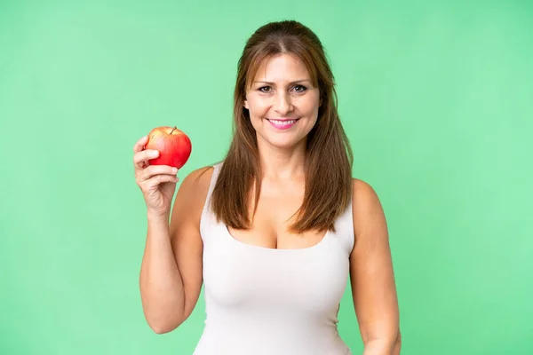 中年女性とともにリンゴ上の隔離された背景笑顔多く — ストック写真