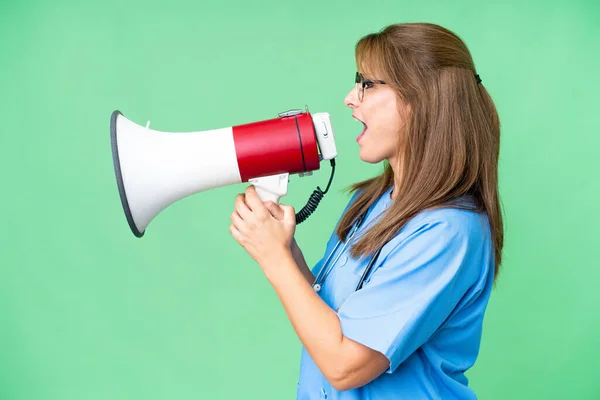 Middle Age Nurse Woman Isolated Background Shouting Megaphone — Stock Photo, Image
