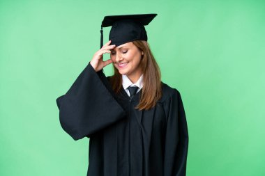 Middle age university graduate woman over isolated background laughing