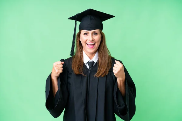 Graduada Universitaria Mediana Edad Sobre Fondo Aislado Celebrando Una Victoria —  Fotos de Stock