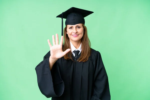 Middle age university graduate woman over isolated background counting five with fingers
