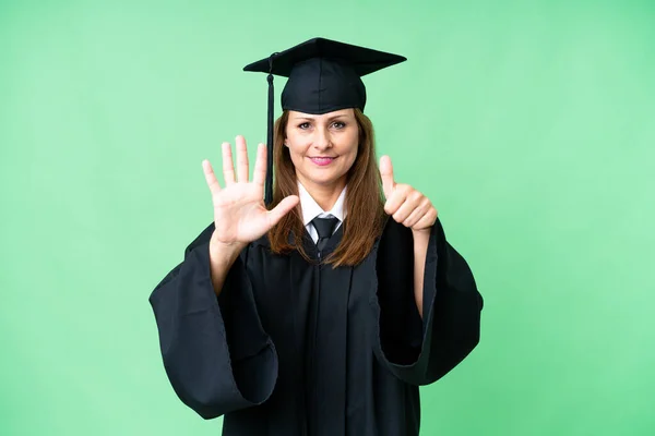 Middle age university graduate woman over isolated background counting six with fingers