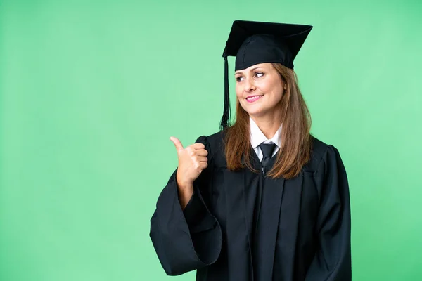 Middle Age University Graduate Woman Isolated Background Pointing Side Present — ストック写真