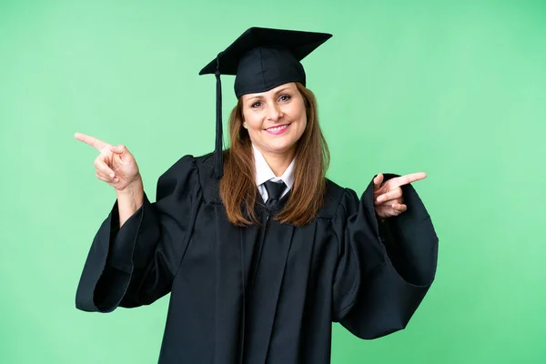 Middle Age University Graduate Woman Isolated Background Pointing Finger Laterals — Stock Photo, Image
