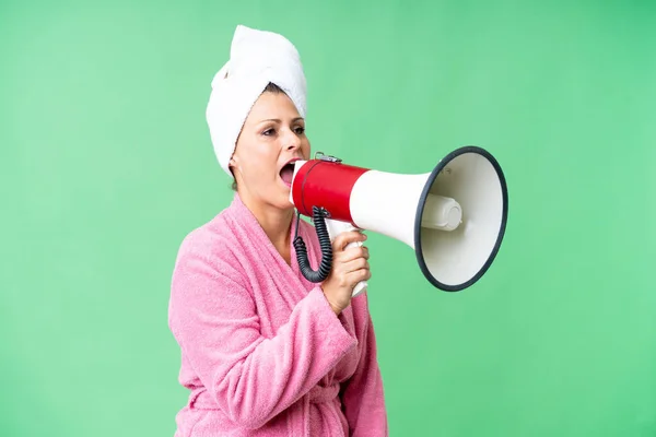 Middle Age Caucasian Woman Bathrobe Isolated Background Shouting Megaphone — Stock Photo, Image