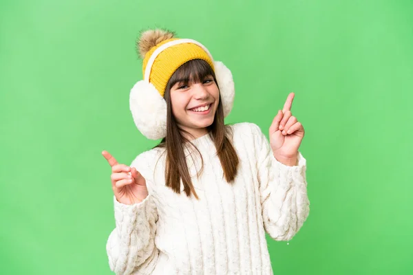 Little Caucasian Girl Wearing Winter Muffs Isolated Background Pointing Finger — Stock Photo, Image