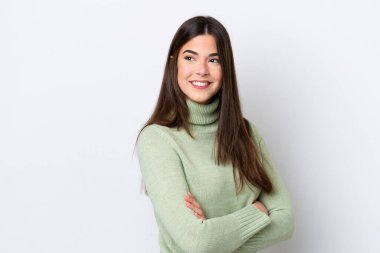 Young Brazilian woman isolated on white background with arms crossed and happy