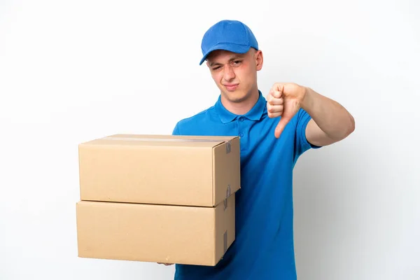 Young Delivery Brazilian Man Isolated Ops White Background Showing Thumb — Foto de Stock