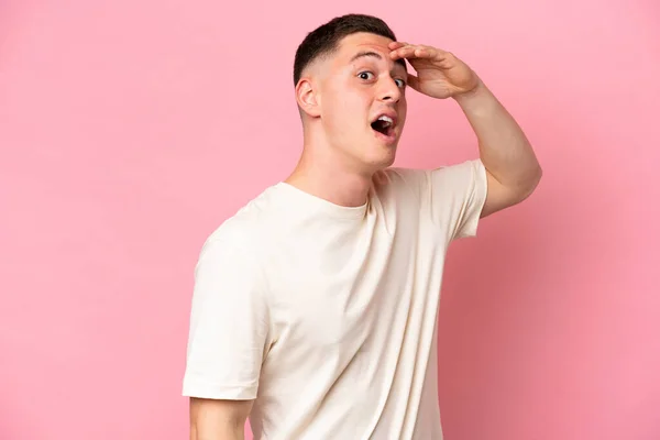 Young Brazilian Man Isolated Pink Background Doing Surprise Gesture While — Stock Photo, Image