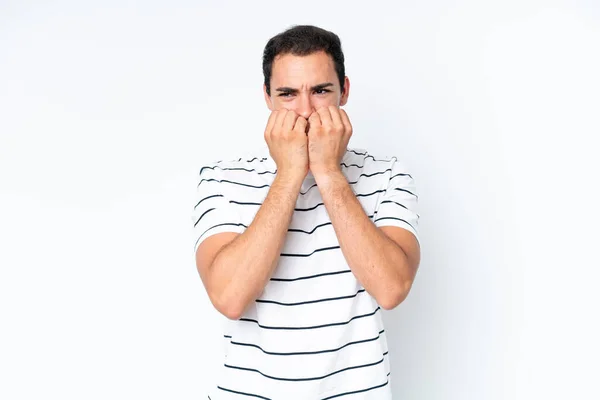 stock image Young caucasian man isolated on white background nervous and scared putting hands to mouth