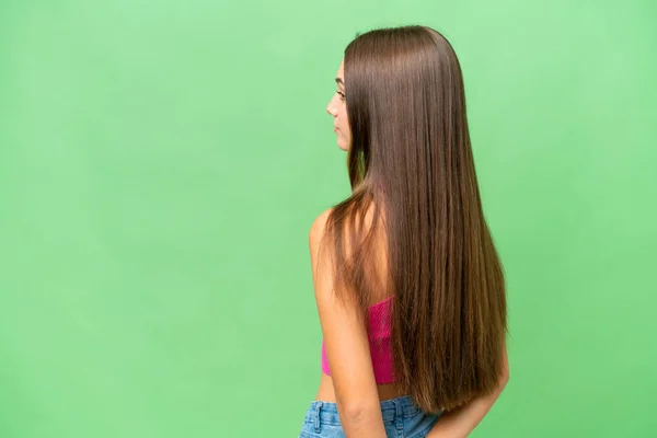 Teenager Caucasian Girl Isolated Background Back Position Looking Back — Stock Photo, Image