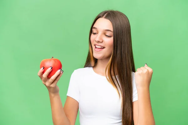 Teenager Kaukasisches Mädchen Hält Einen Apfel Über Isoliertem Hintergrund Und — Stockfoto