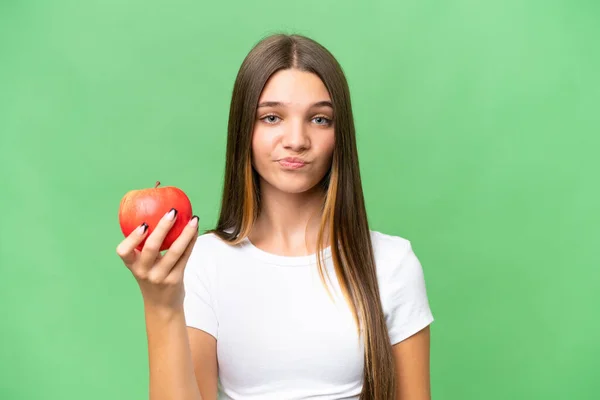 Teenager Běloška Dívka Drží Jablko Nad Izolovaným Pozadím Smutným Výrazem — Stock fotografie