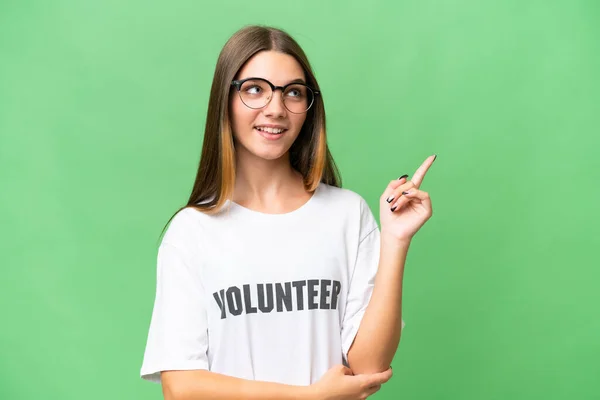 Teenager Volunteer Caucasian Girl Isolated Background Pointing Great Idea — Stock Photo, Image