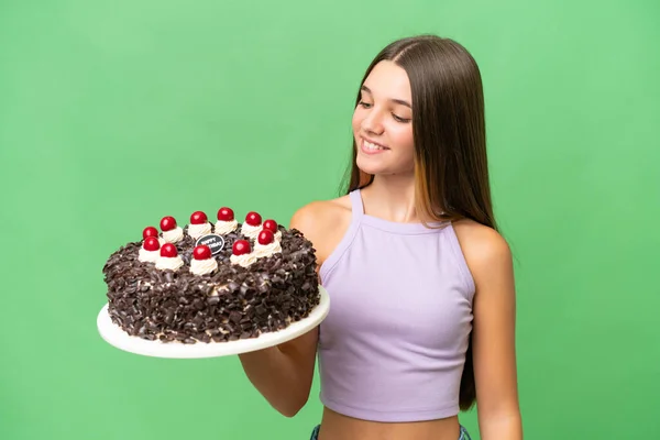 stock image Teenager caucasian girl holding birthday cake over isolated background with happy expression