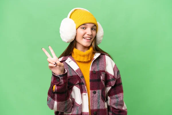 Adolescente Caucásico Chica Usando Invierno Muffs Sobre Aislado Fondo Sonriendo — Foto de Stock