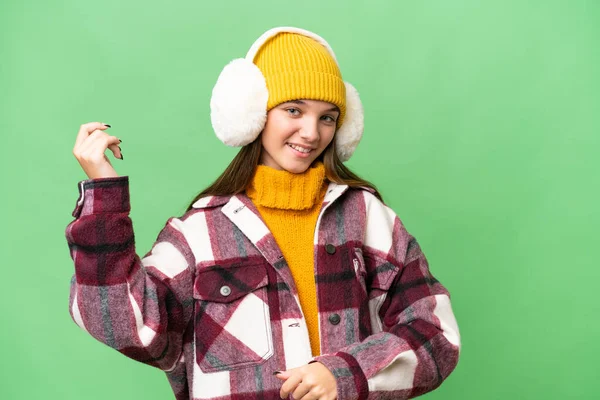 Teenager Caucasian Girl Wearing Winter Muffs Isolated Background Making Guitar — Stock Photo, Image