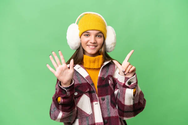 Adolescente Caucásico Chica Usando Invierno Muffs Sobre Aislado Fondo Contando —  Fotos de Stock