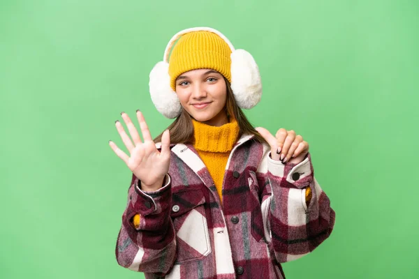 Adolescente Caucásico Chica Usando Invierno Muffs Sobre Aislado Fondo Contando — Foto de Stock