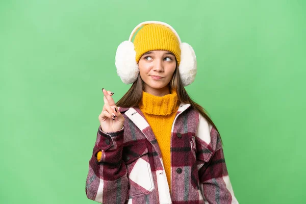 Έφηβος Καυκάσιος Κορίτσι Φορώντας Muffs Χειμώνα Πάνω Από Απομονωμένη Φόντο — Φωτογραφία Αρχείου