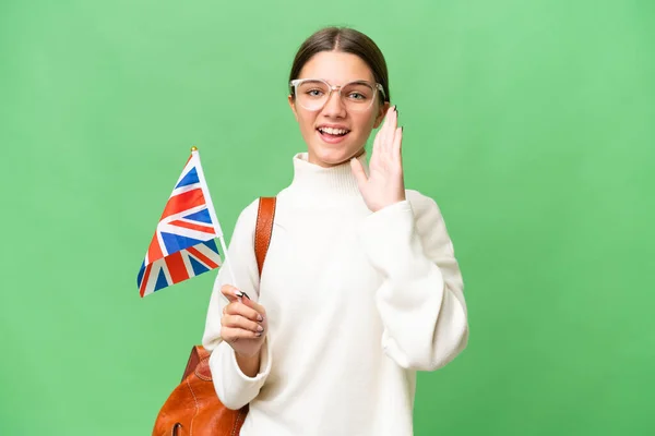 十几岁的学生高举英国国旗高呼着英国国旗高喊着 张大了嘴 — 图库照片