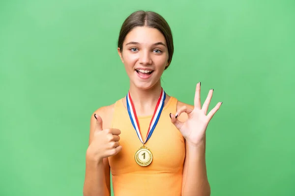 Teenager Běloška Dívka Medailemi Nad Izolované Pozadí Ukazující Znamení Palec — Stock fotografie