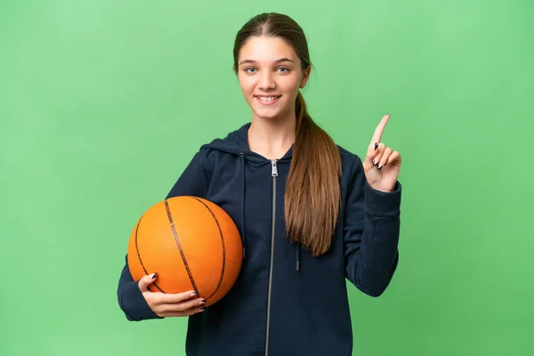 Teenager Caucasian Girl Playing Basketball Isolated Background Pointing Great Idea — 스톡 사진