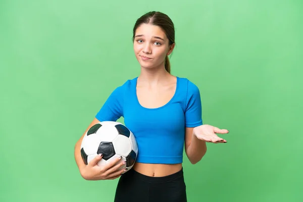 Teenager Caucasian Girl Playing Football Isolated Background Making Doubts Gesture — Stock Photo, Image