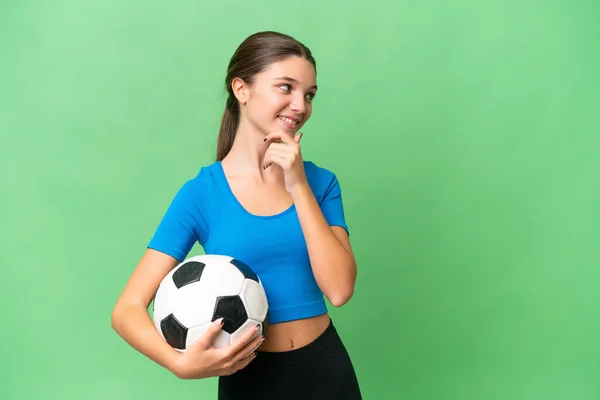 Teenager Caucasian Girl Playing Football Isolated Background Thinking Idea Looking — Stock Photo, Image