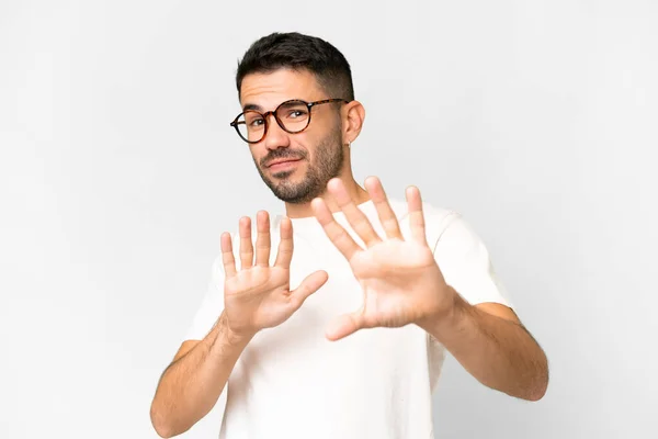 Jonge Knappe Blanke Man Geïsoleerde Witte Achtergrond Nerveuze Stretching Handen — Stockfoto