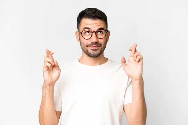 Young Handsome Caucasian Man Isolated White Background Fingers Crossing Wishing — Stock Photo, Image