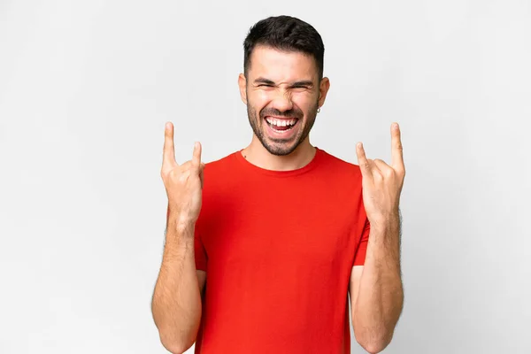 Young Handsome Caucasian Man Isolated White Background Making Horn Gesture —  Fotos de Stock