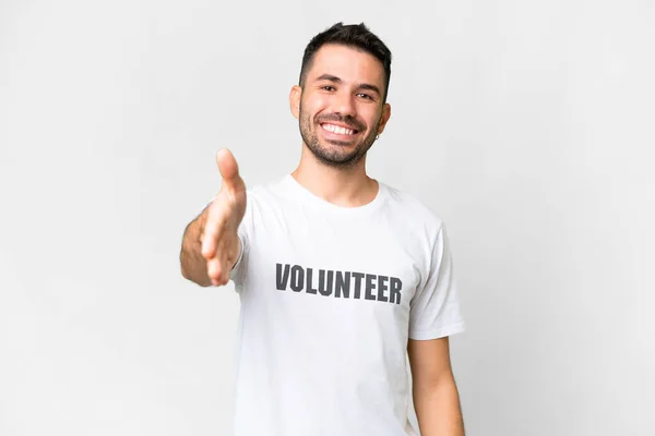 Young Volunteer Caucasian Man Isolated White Background Shaking Hands Closing — Stock Photo, Image