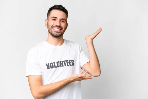 Young Volunteer Caucasian Man Isolated White Background Extending Hands Side — Stock Photo, Image