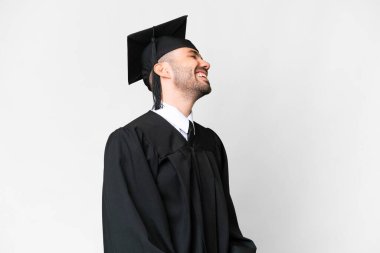 Young university graduate man over isolated white background laughing in lateral position