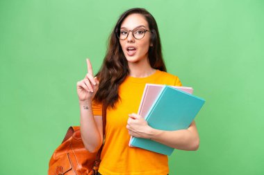 Young student caucasian woman over isolated background thinking an idea pointing the finger up