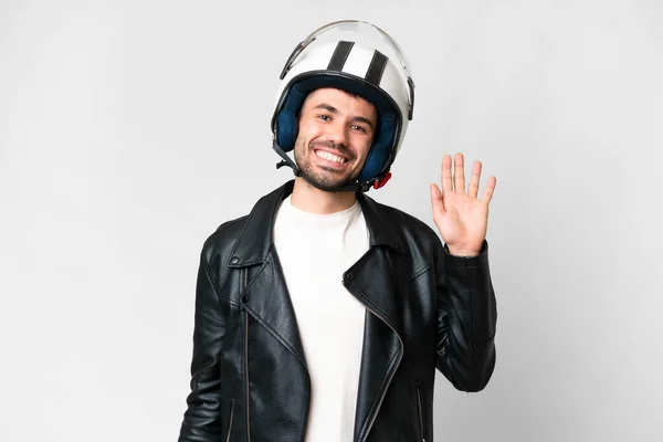 Молодой Кавказский Мужчина Мотоциклетном Шлеме Изолированном Белом Фоне Приветствуя Руками — стоковое фото