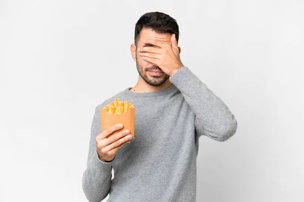 Young Caucasian Man Holding Fried Chips Isolated White Background Covering — Stock Photo, Image