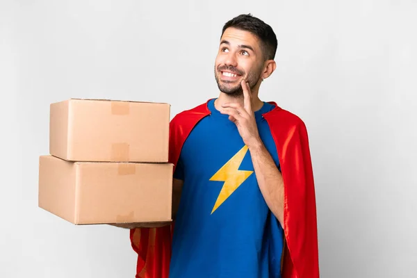 Super Hero Delivery Caucasian Man Isolated White Background Thinking Idea — Stock Photo, Image