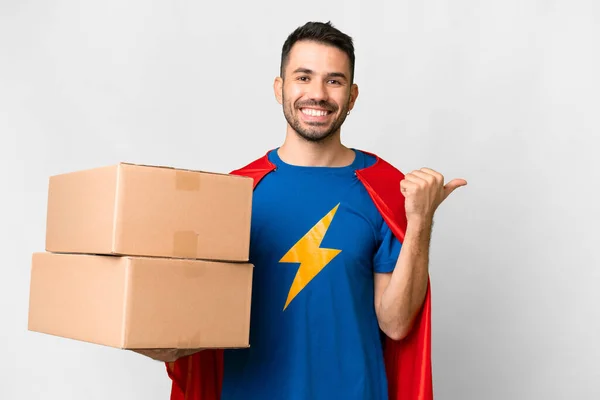 Super Hero Delivery Caucasian Man Isolated White Background Pointing Side — Stock Photo, Image