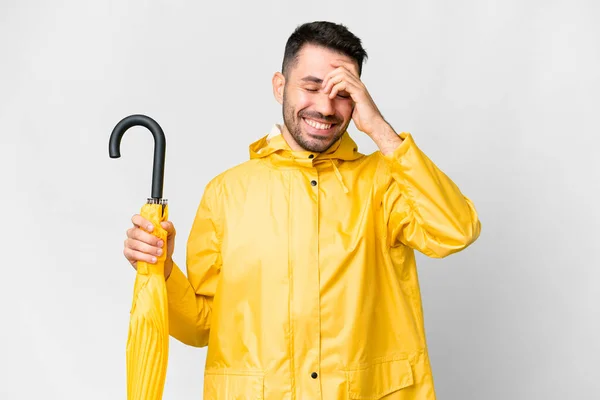 Young Caucasian Man Rainproof Coat Umbrella Isolated White Background Laughing — ストック写真