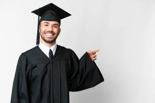 Young University Graduate Man Isolated White Background Pointing Finger Side — Stockfoto
